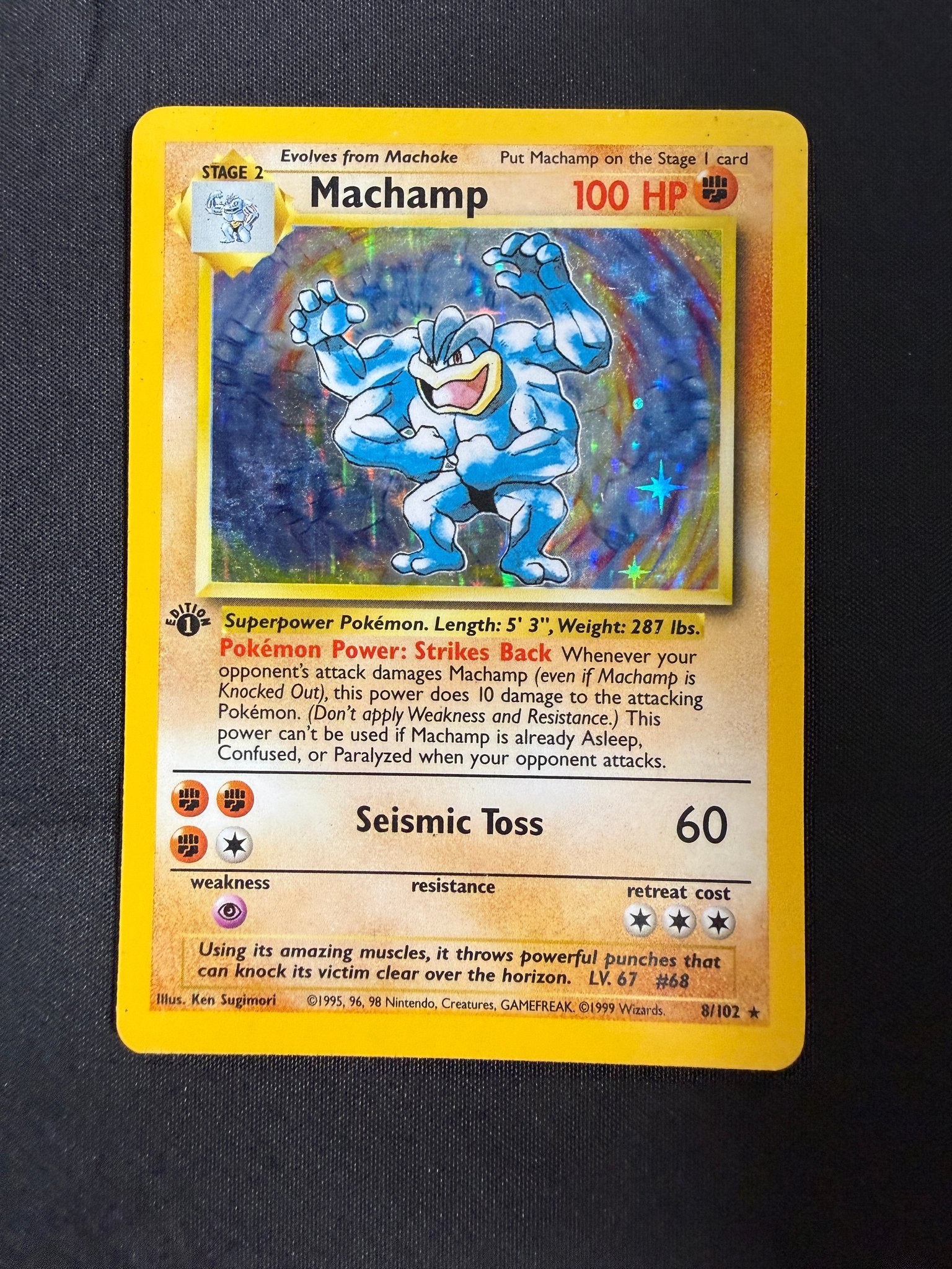 1999 Machamp Base Set 1st Edition Holo 8/102 front
