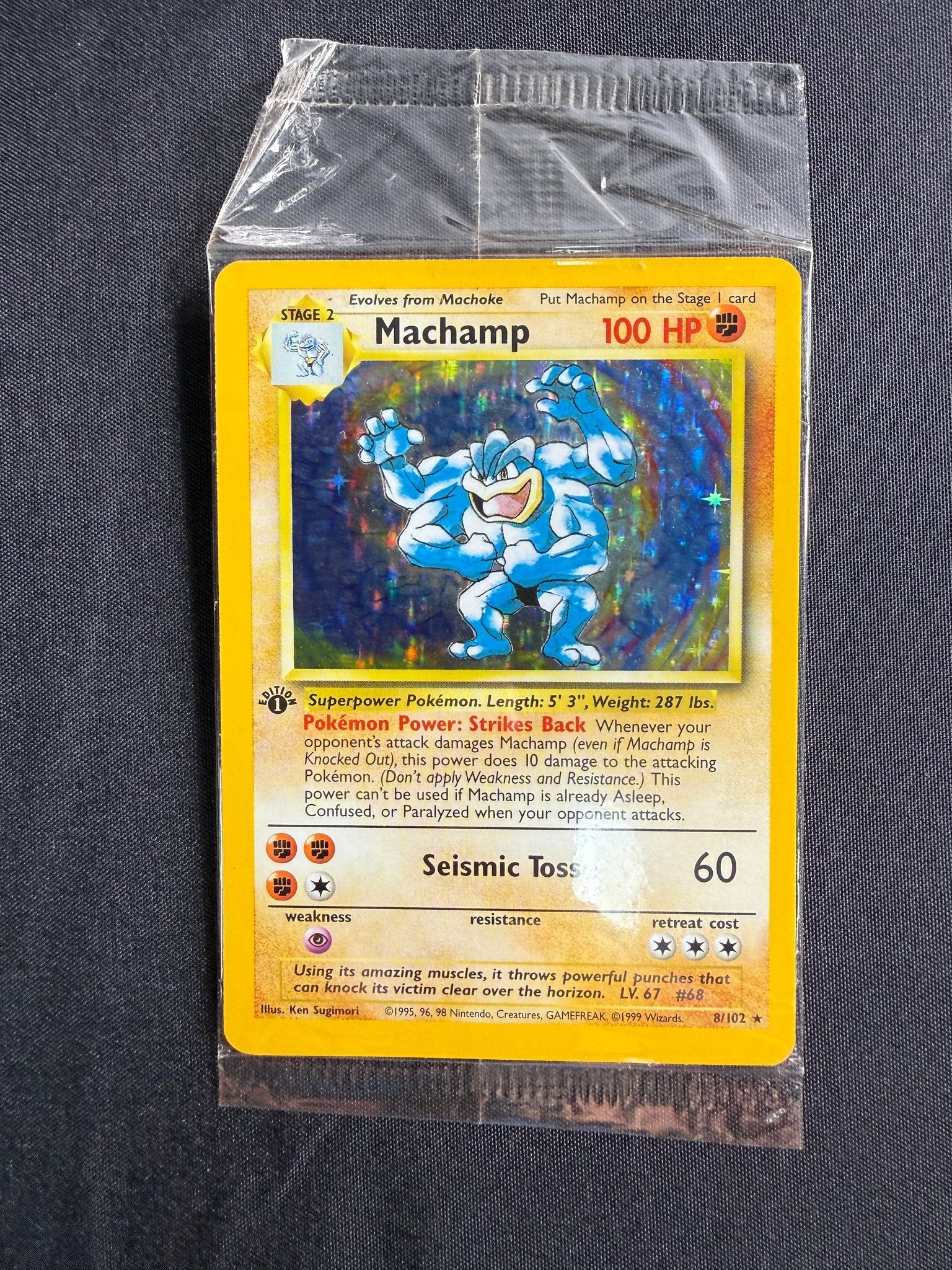 1999 Machamp Base Set 1st Edition Holo 8/102 front