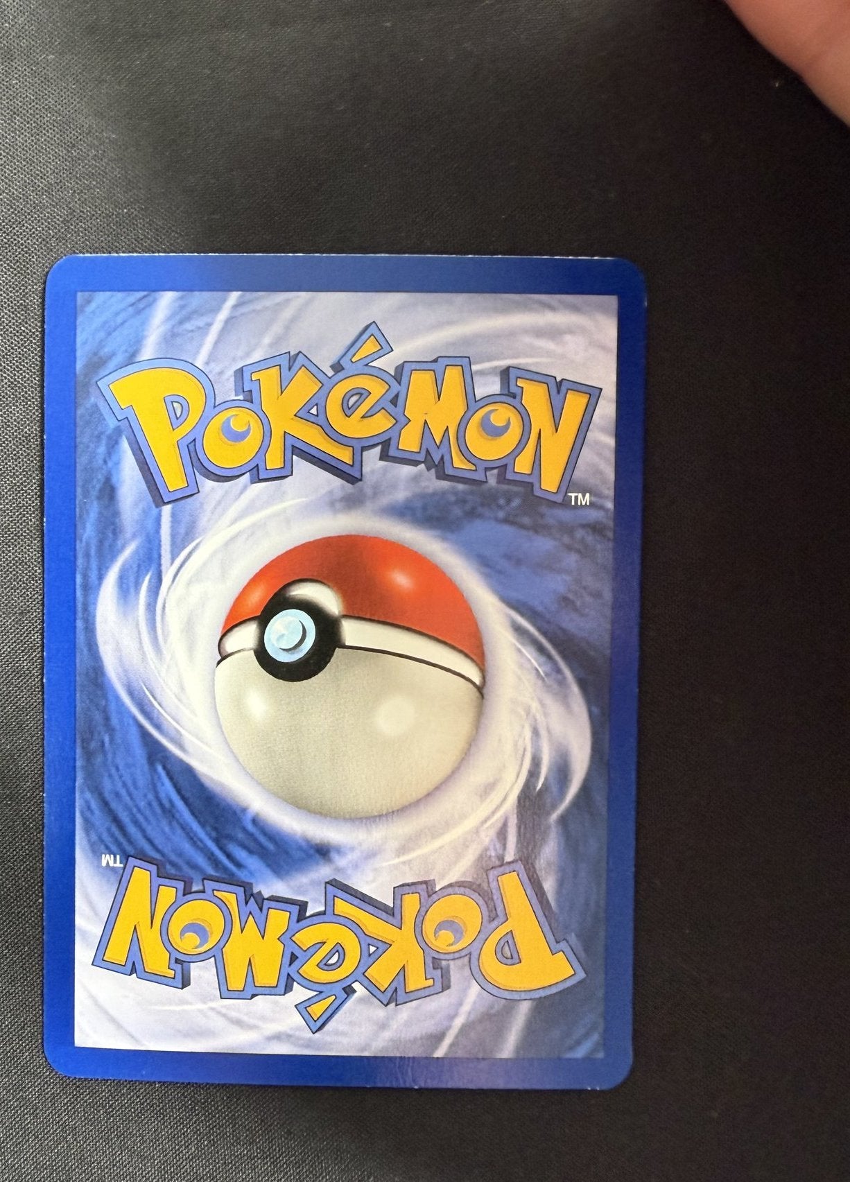 Back of the 1999 Fossil Lapras 1st Edition holo card 10/62, showing the standard blue Pokemon card back with centered Poke Ball