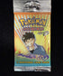 Front of a sealed 2000 Pokemon Gym Heroes booster pack with Brock artwork, reading Trading Card Game and 11 Additional Game Cards