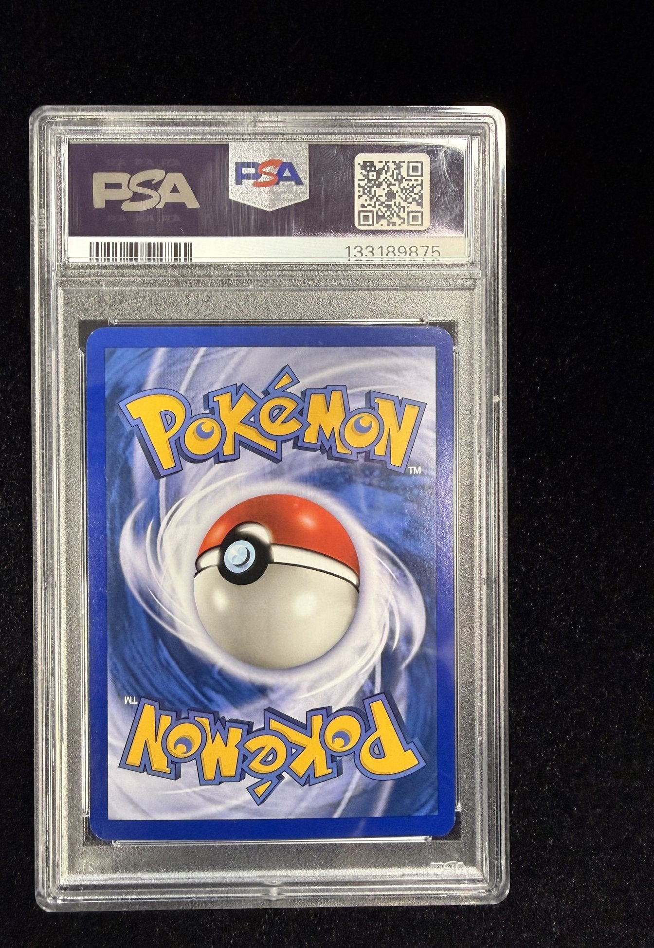 Back of the PSA slab holding the 2003 Aquapolis Eevee reverse holo 75/147, showing the PSA hologram, QR code and cert number 133189875